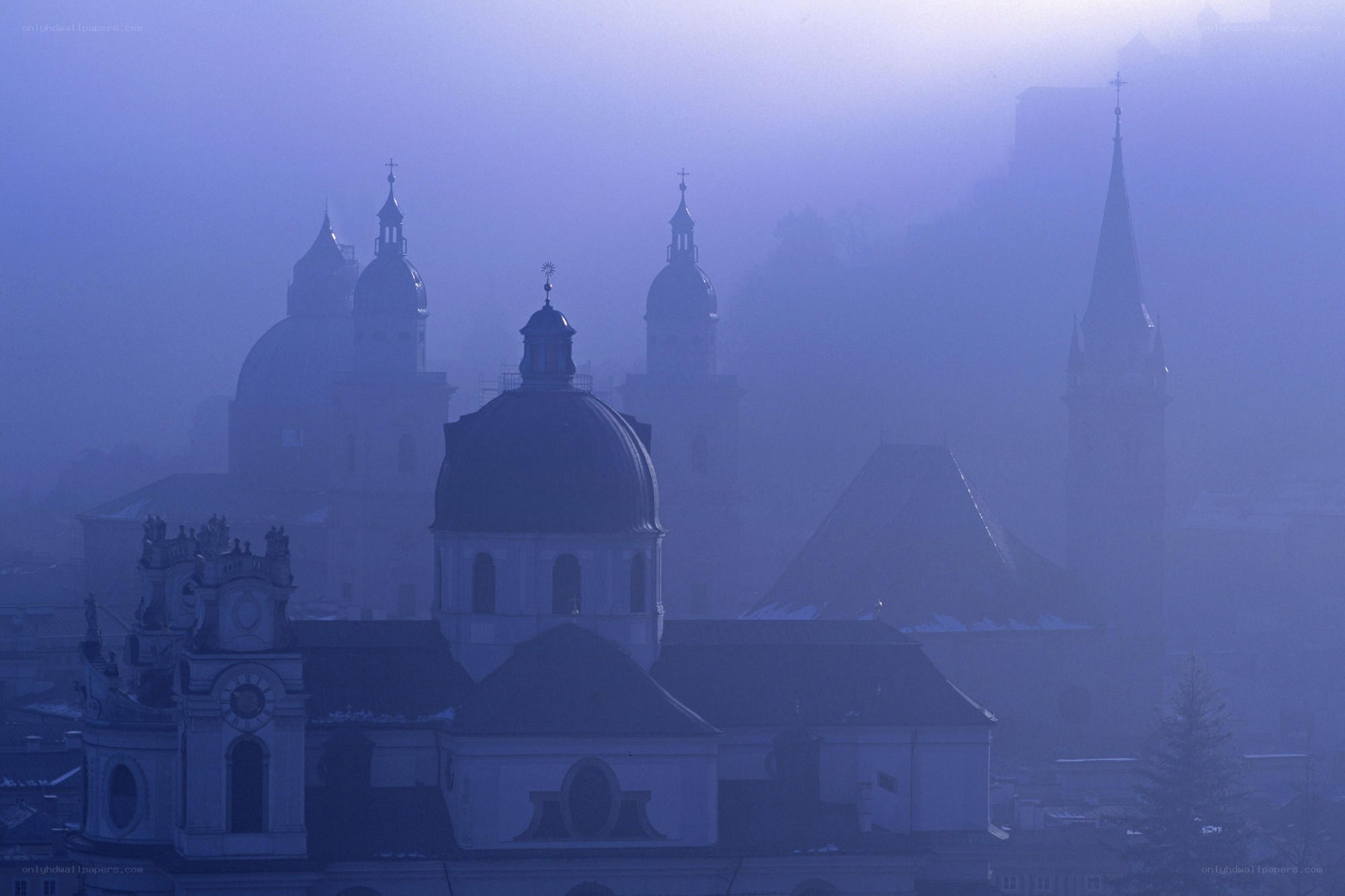 foggy city with domes and spires