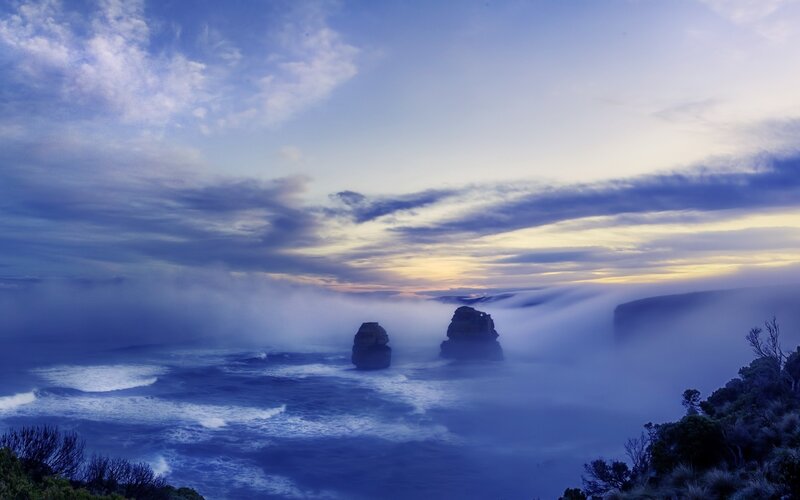 Foggy coastal cliffs at dawn