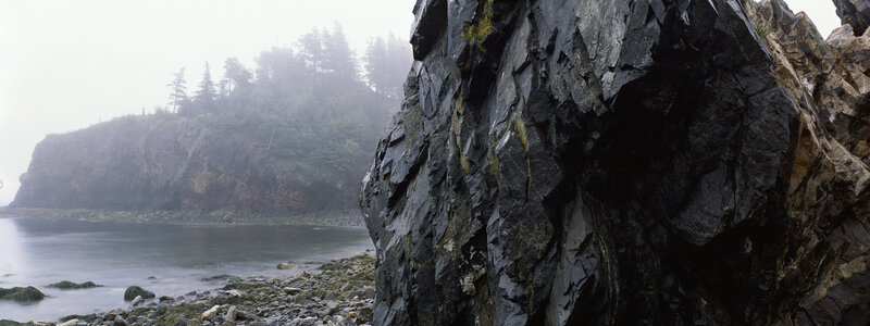 foggy coastal rock formation