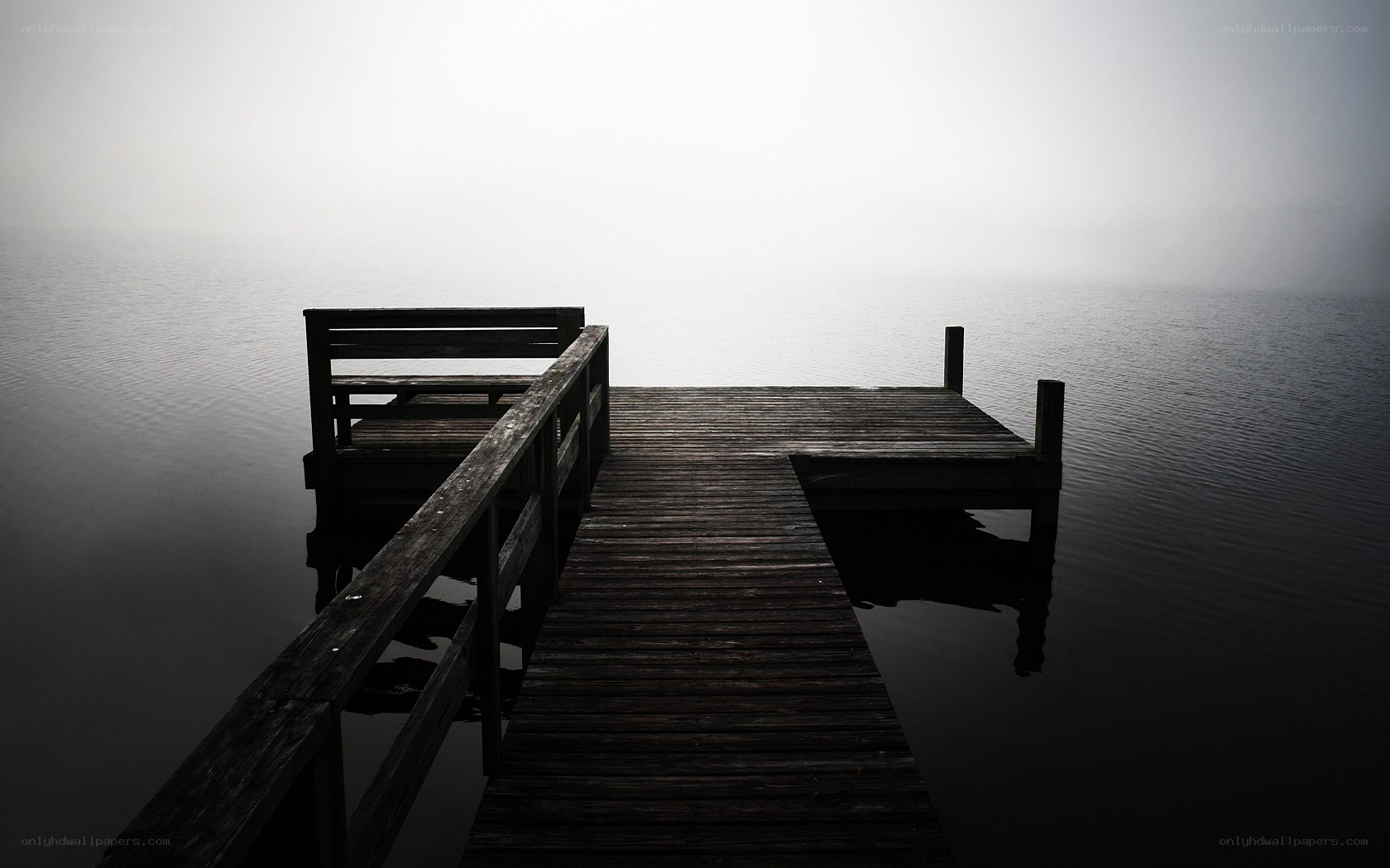 Foggy dock at dawn