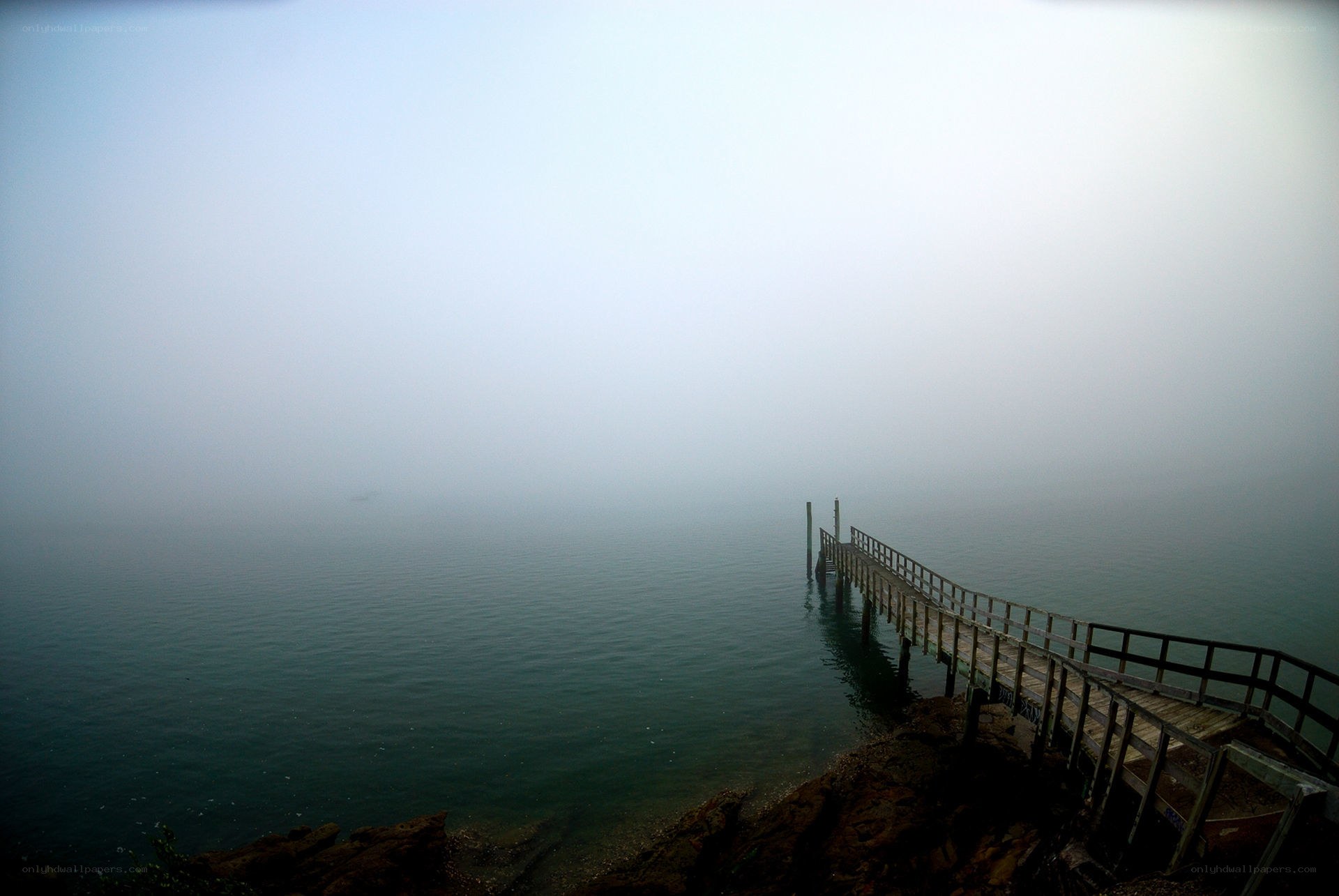 Foggy dock at dawn