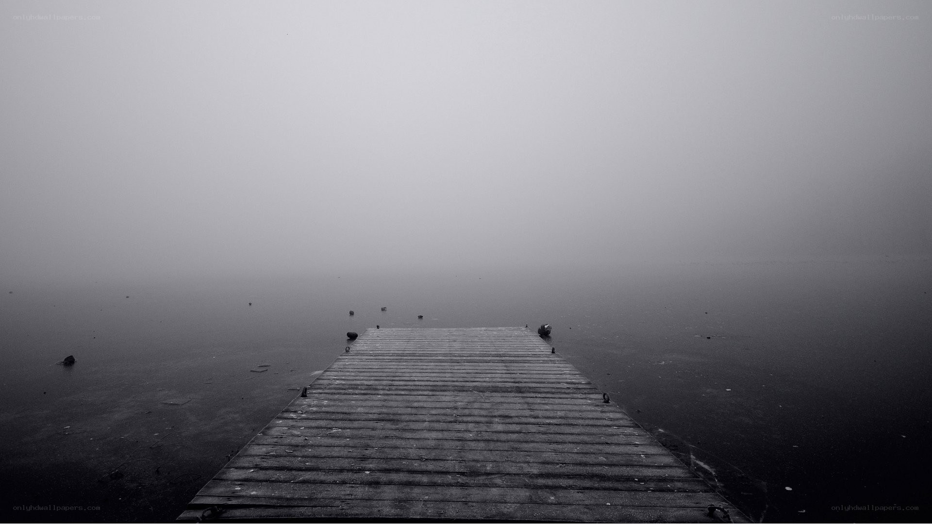 Foggy dock on a calm lake