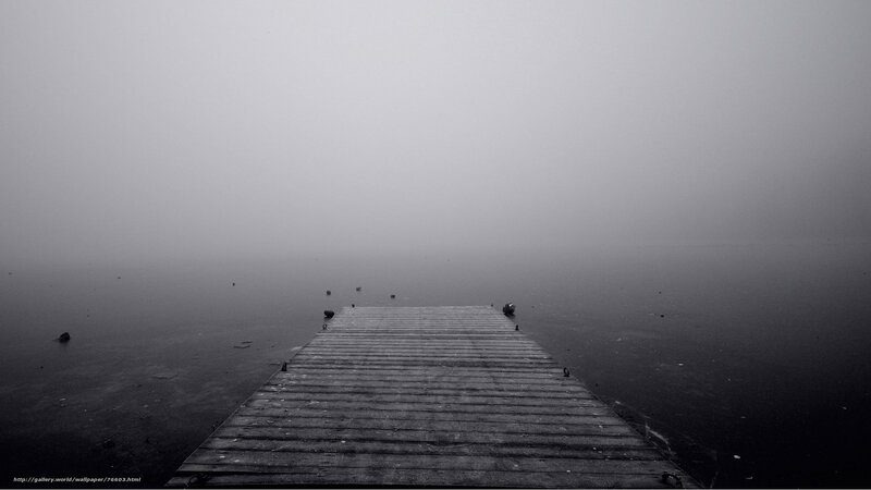 Foggy dock on calm water