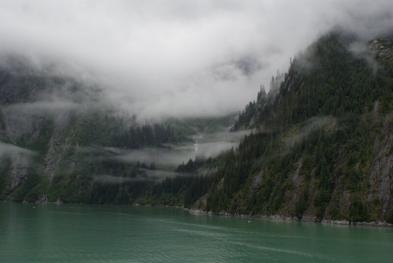 foggy fjord with waterfall