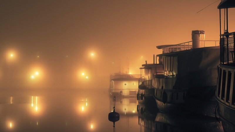Foggy harbor at night