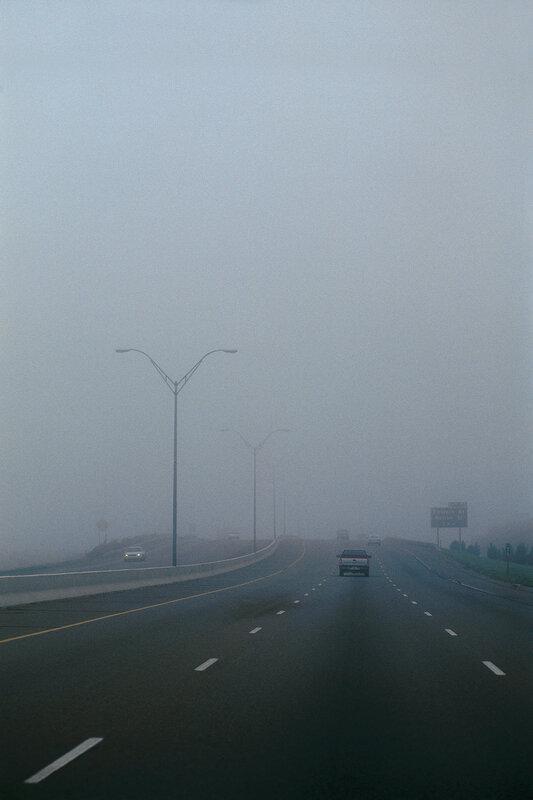 Foggy highway at dawn