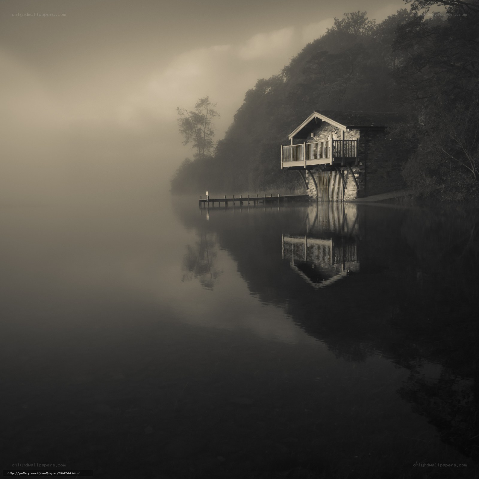 Foggy lake house at dawn