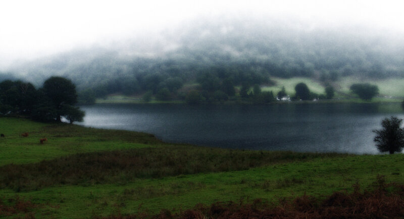 Foggy lake in a green valley