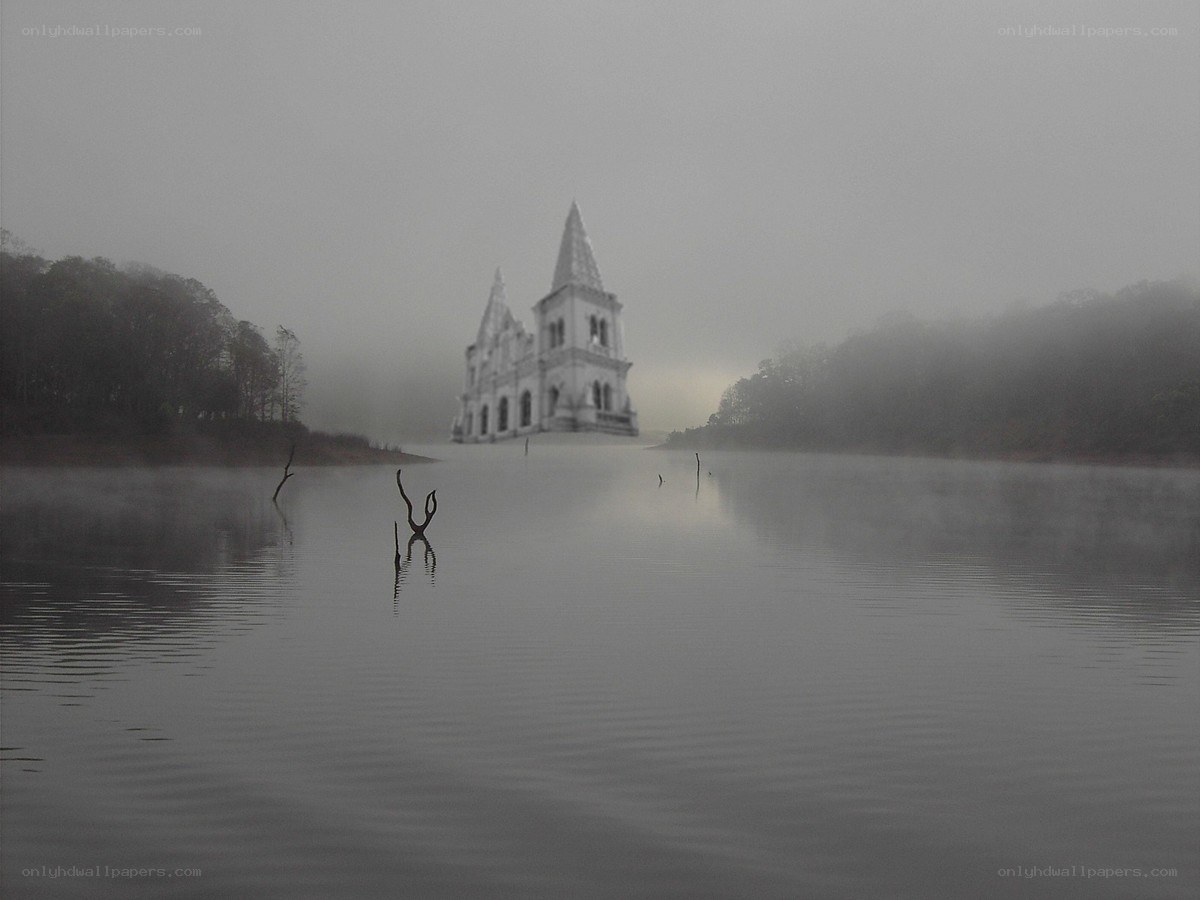 Foggy lake with church
