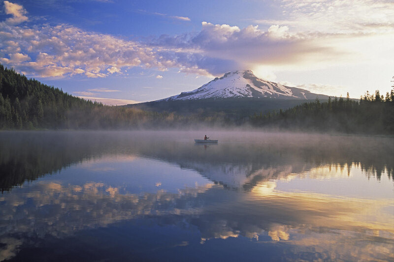 Foggy lake with snow-capped mountain