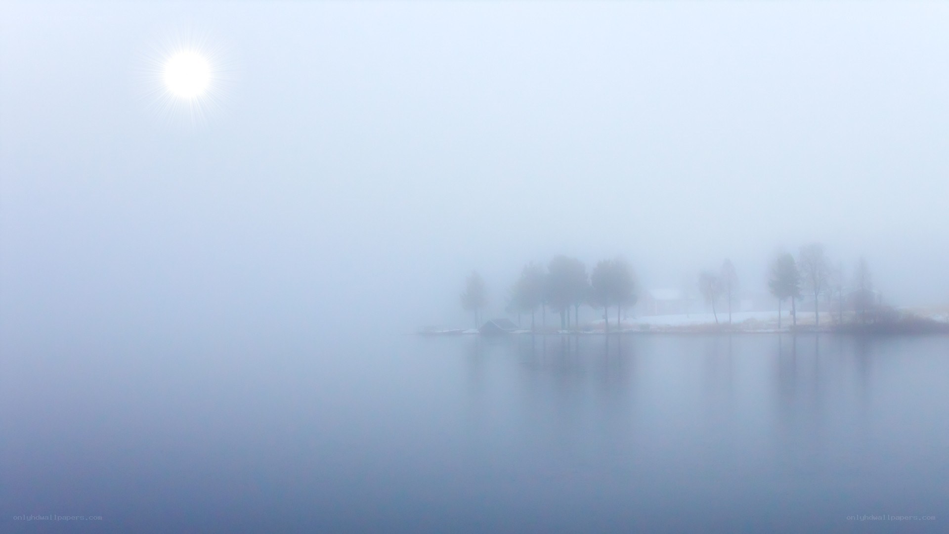 Foggy lake with sun