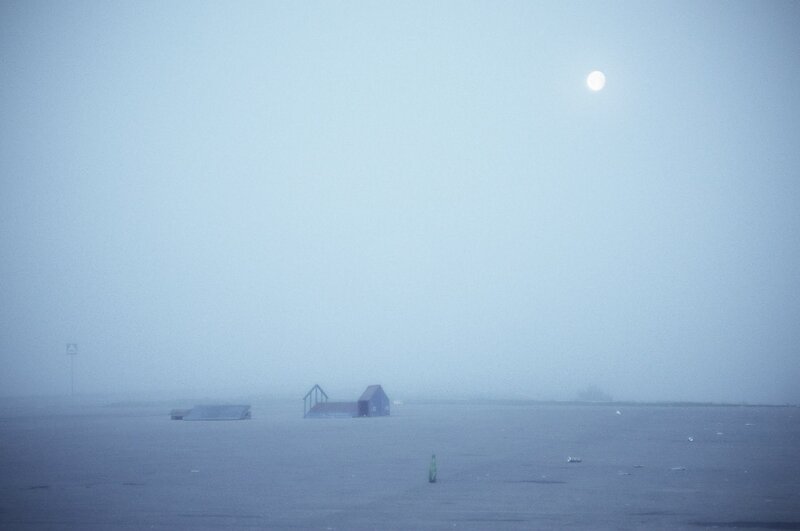 Foggy landscape with moon