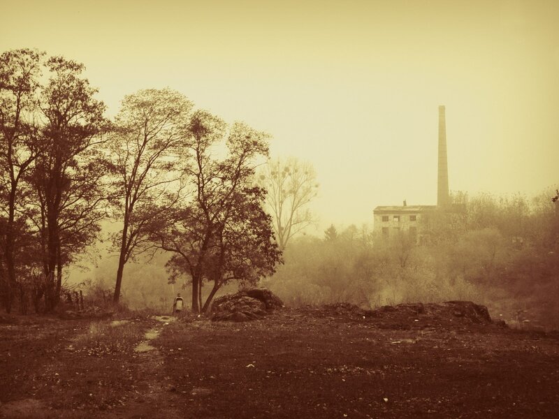 Foggy landscape with old factory