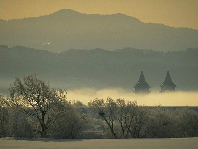 Foggy landscape with towers