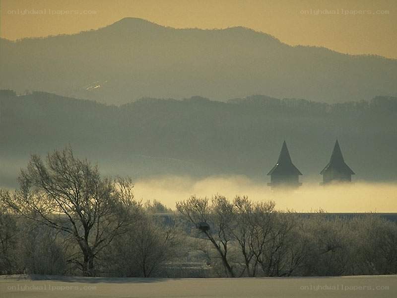 Foggy landscape with towers