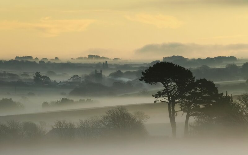 Foggy morning over a village