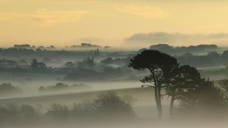 Foggy morning over a village
