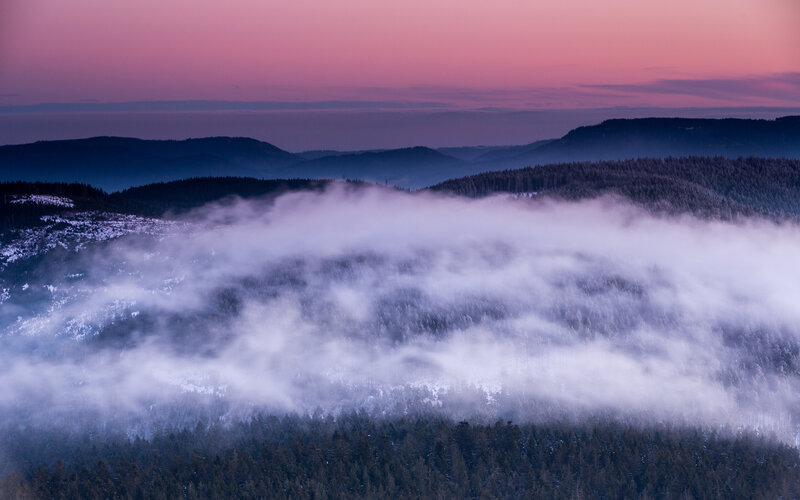 Foggy mountain landscape at dusk
