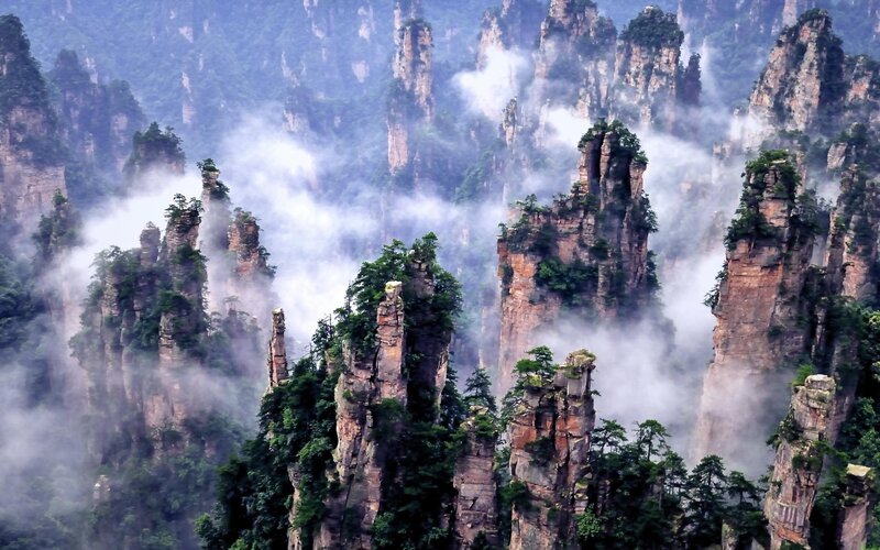 Foggy mountain pillars in China