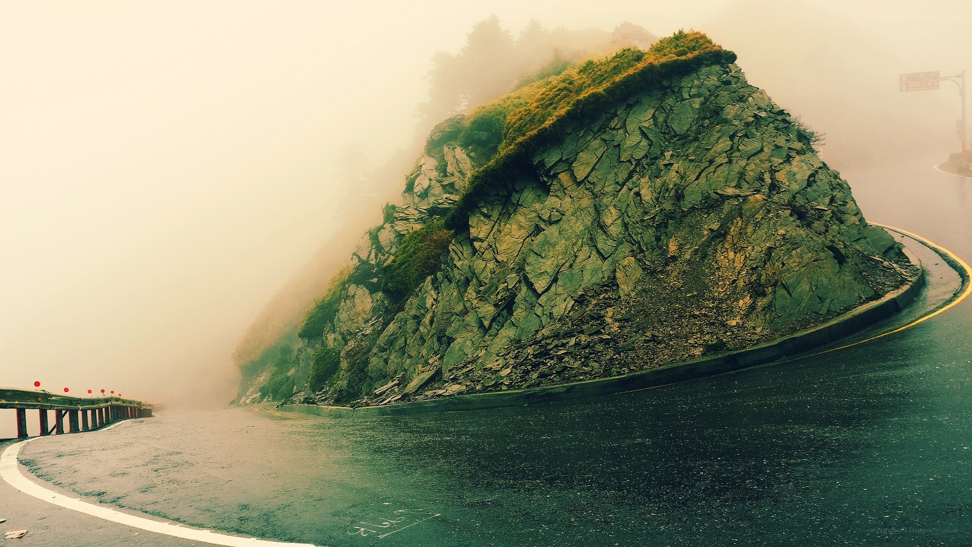 Foggy mountain road curve