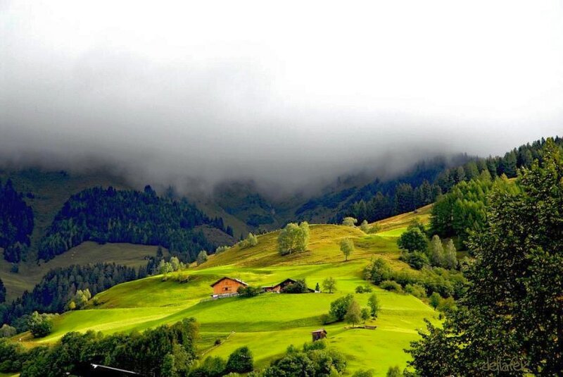 Foggy mountain valley with houses
