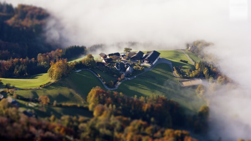 Foggy mountain village aerial view