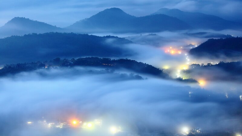 Foggy mountain village at dawn