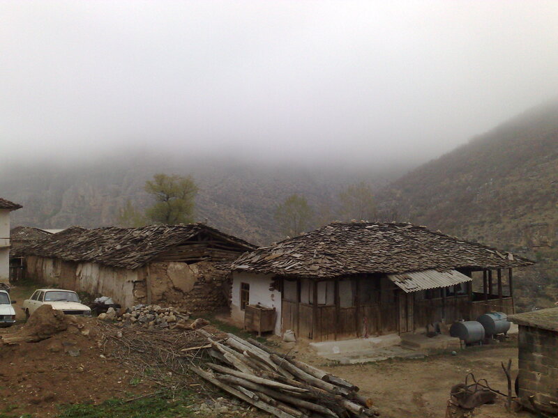 Foggy mountain village scene