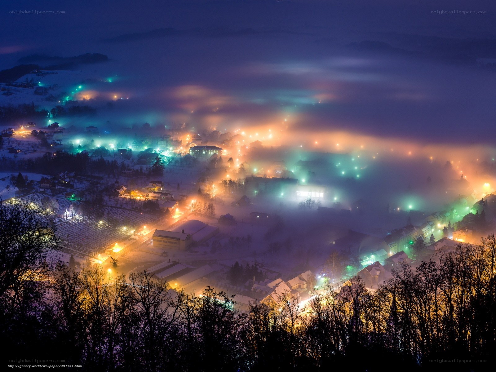 Foggy Night Over a Snowy Town