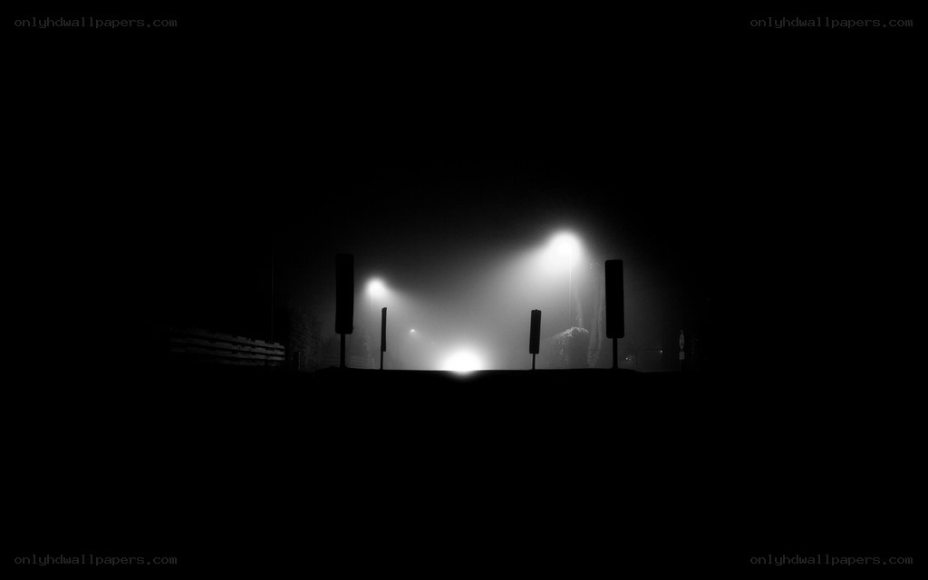 Foggy night street lights