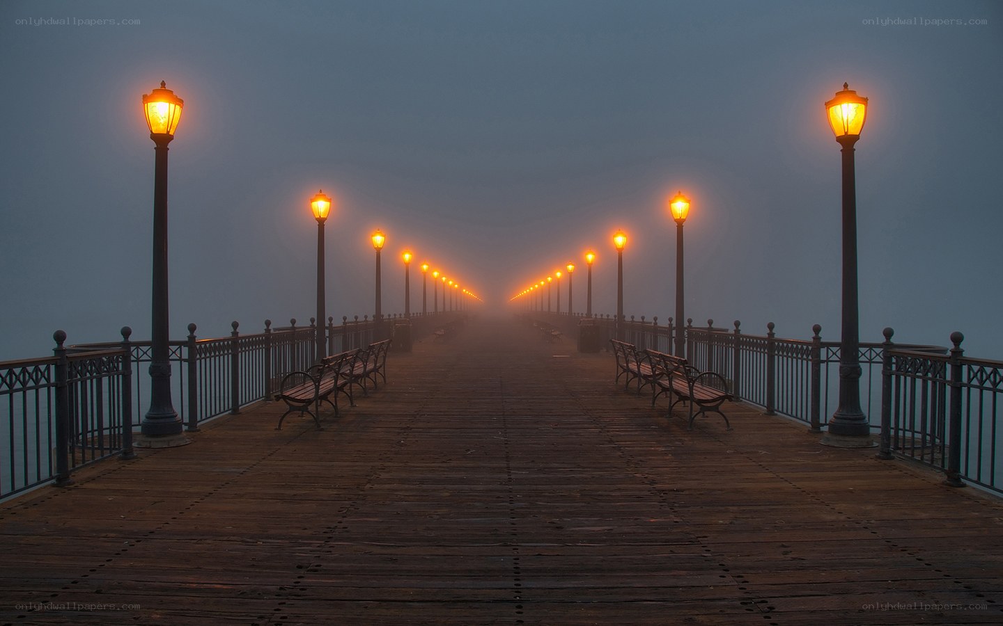 Foggy pier at dawn