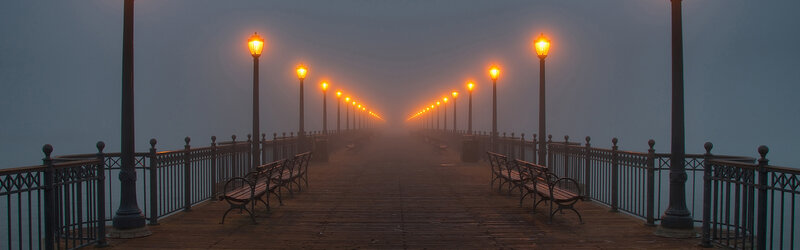Foggy pier at dawn