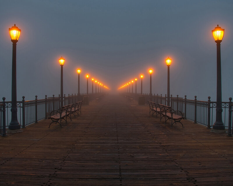 Foggy pier at dawn