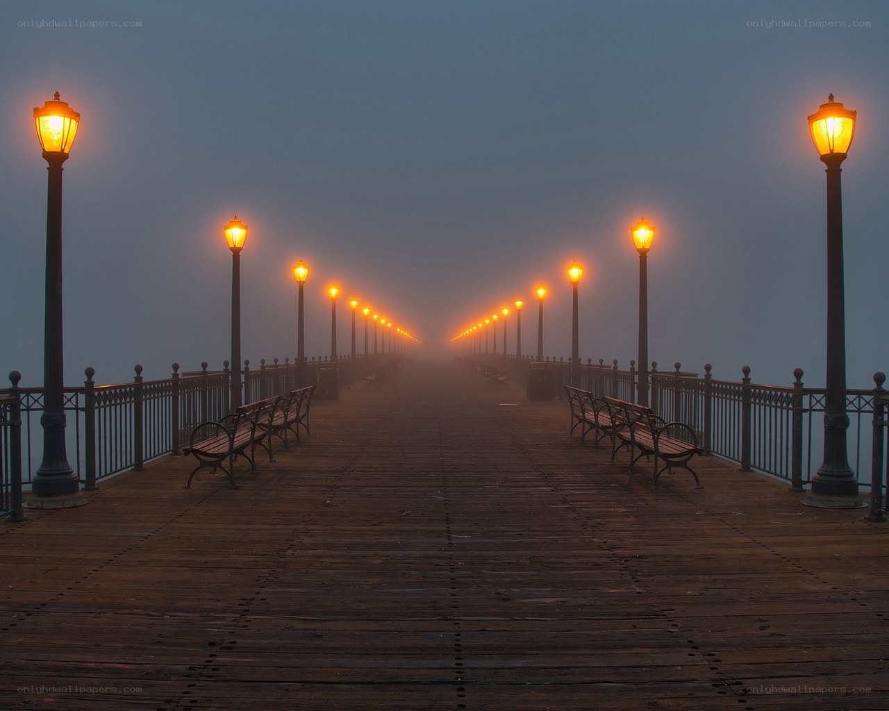 Foggy pier at dawn