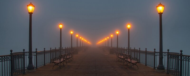 Foggy pier at dawn