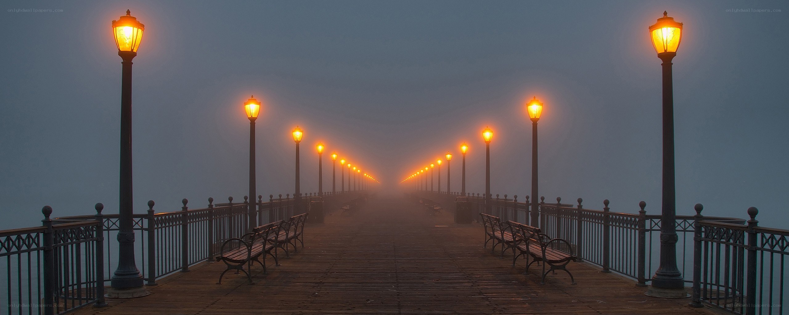 Foggy pier at dawn
