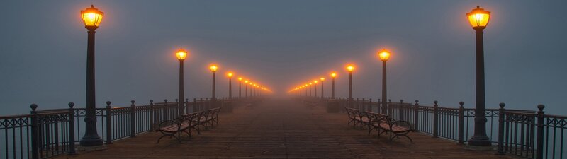 Foggy pier at dawn