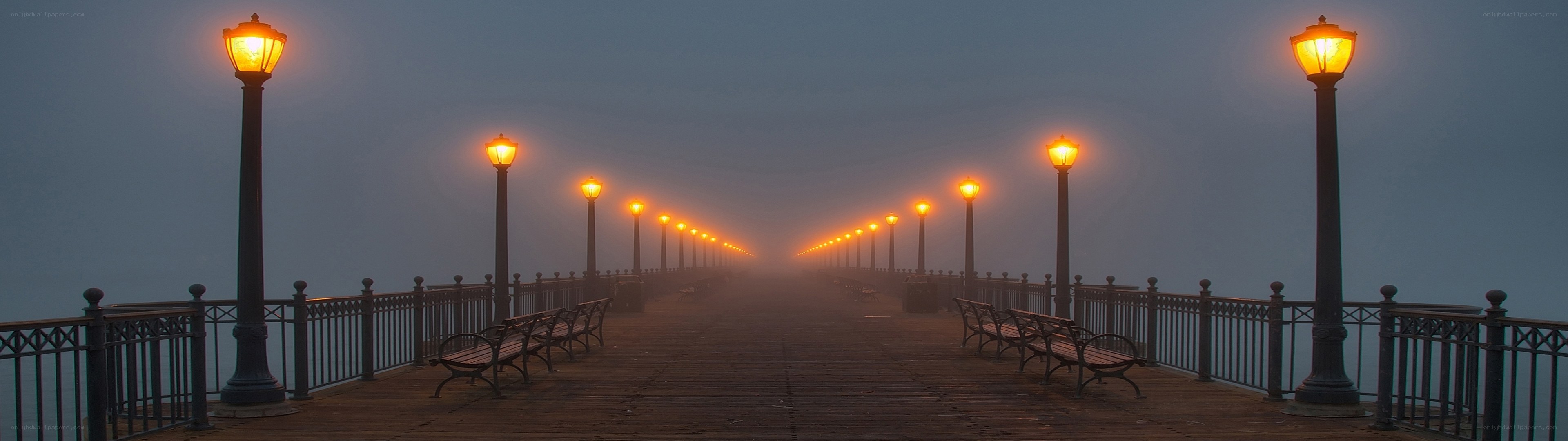 Foggy pier at dawn
