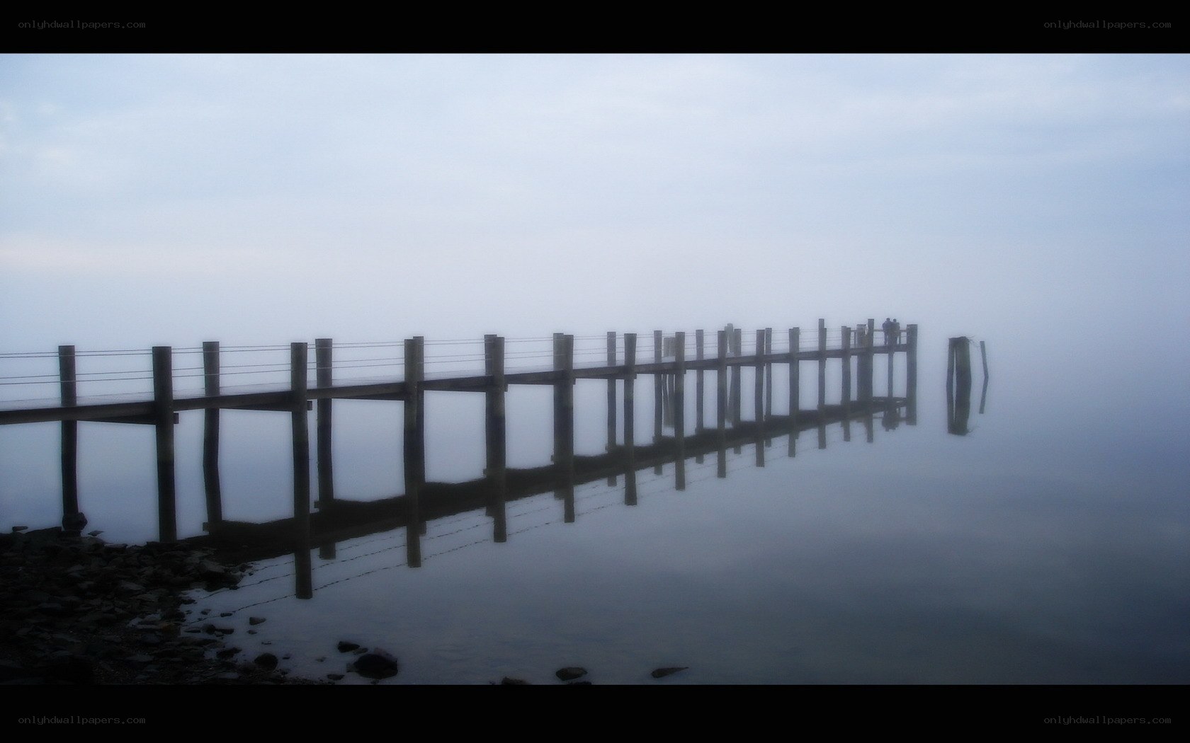 Foggy pier at dawn