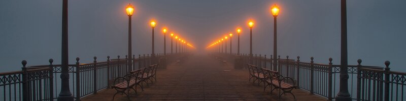 Foggy pier at dawn