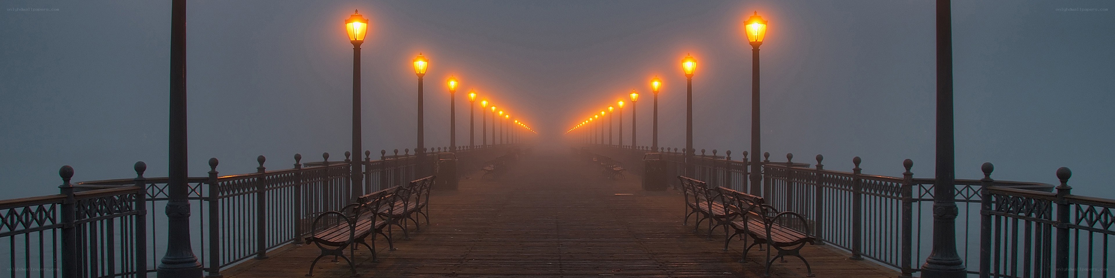 Foggy pier at dawn