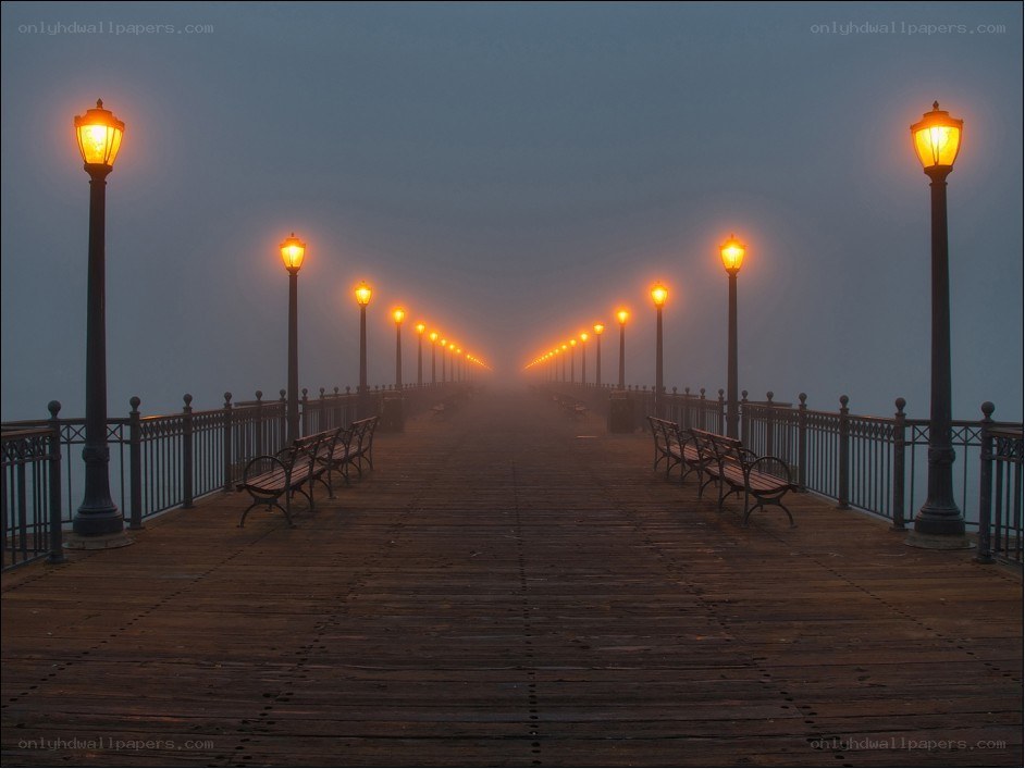 Foggy pier at dawn