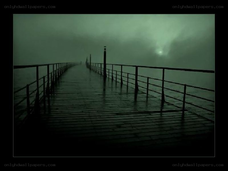 foggy pier at night