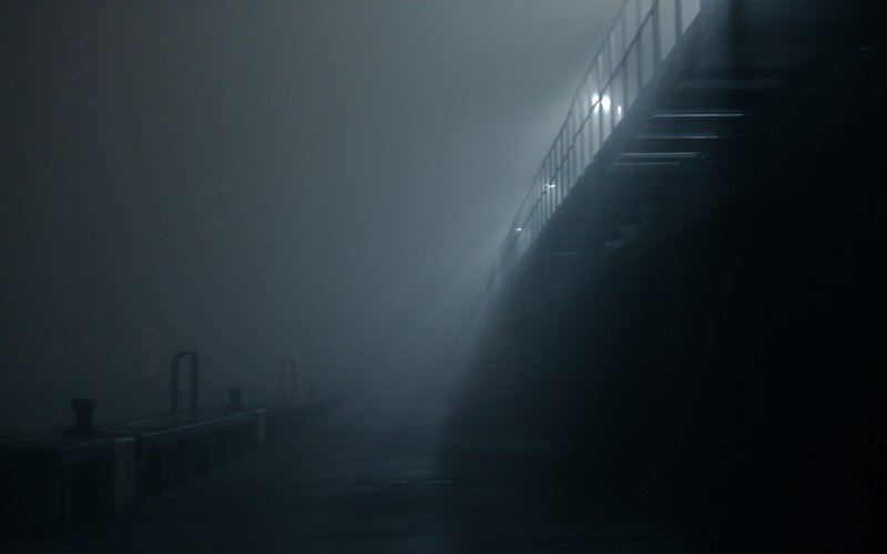 foggy pier at night