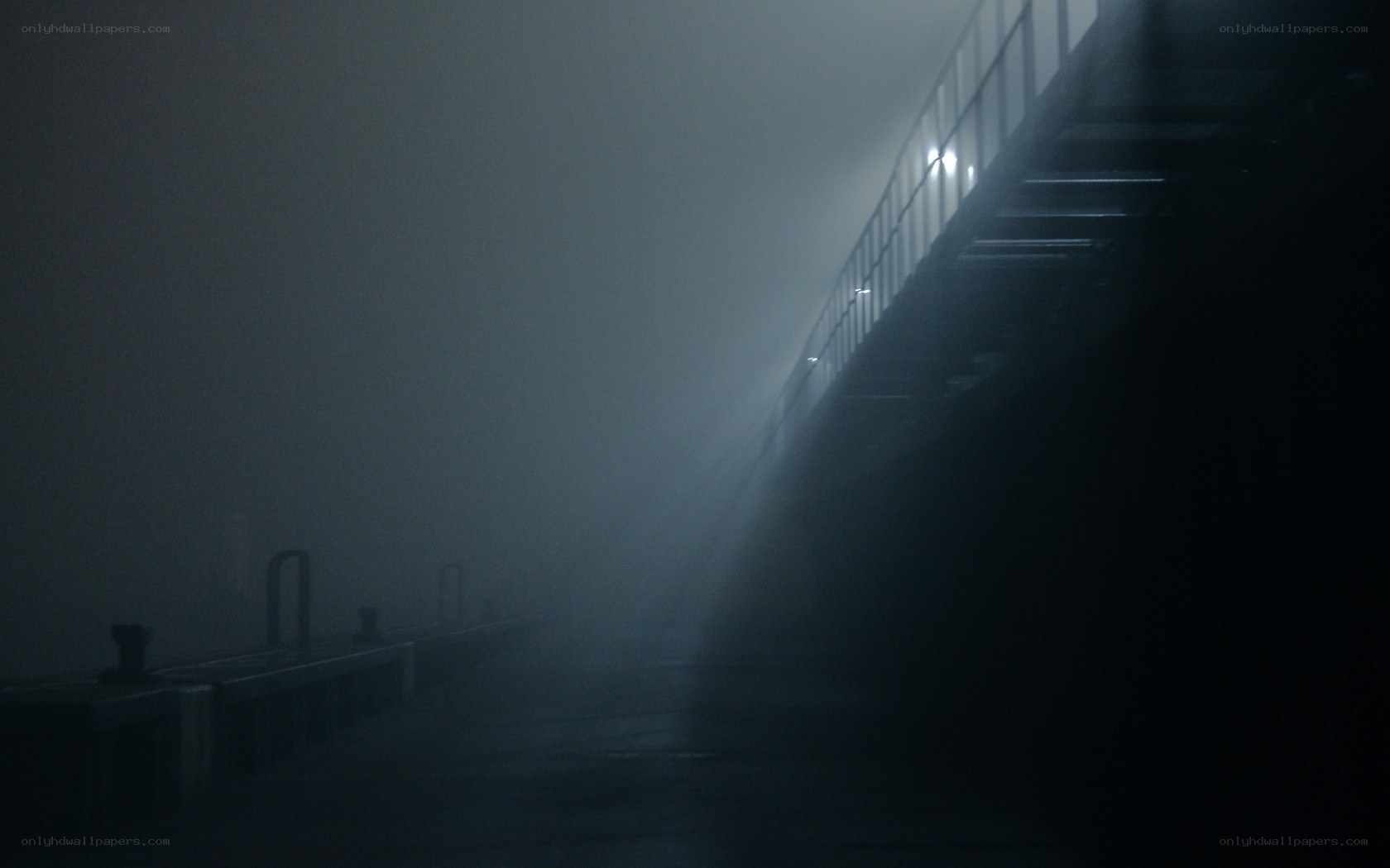 foggy pier at night