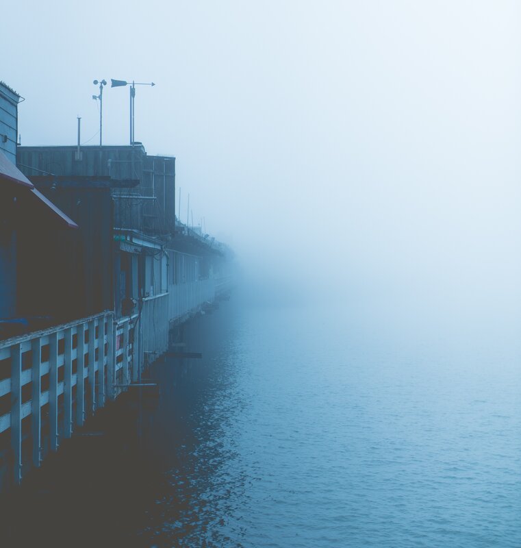 Foggy Pier with Buildings