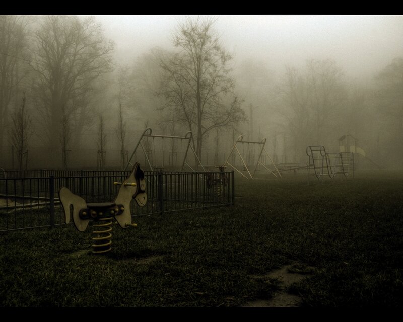 Foggy playground at dawn