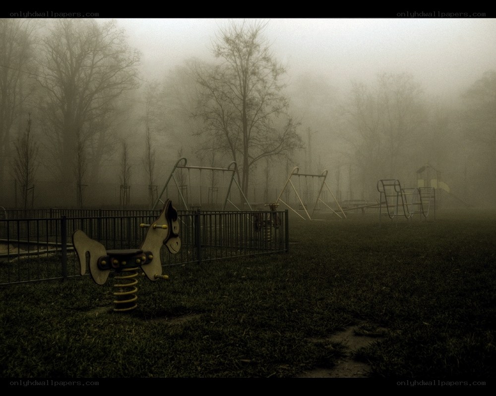Foggy playground at dawn