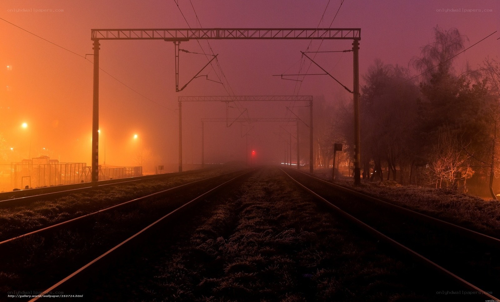 Foggy railway tracks at dawn