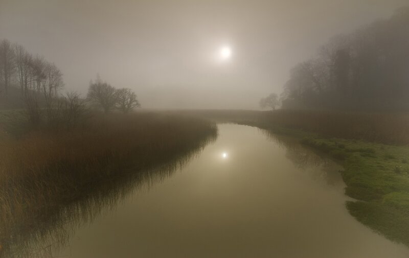 Foggy river at sunrise